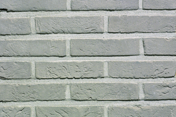 Packshot of a panel with Agora zilvergrijs facing bricks
